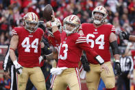 San Francisco 49ers quarterback Brock Purdy (13) celebrates with teammates after running for a touchdown against the Tampa Bay Buccaneers during the first half of an NFL football game in Santa Clara, Calif., Sunday, Dec. 11, 2022. (AP Photo/Jed Jacobsohn)