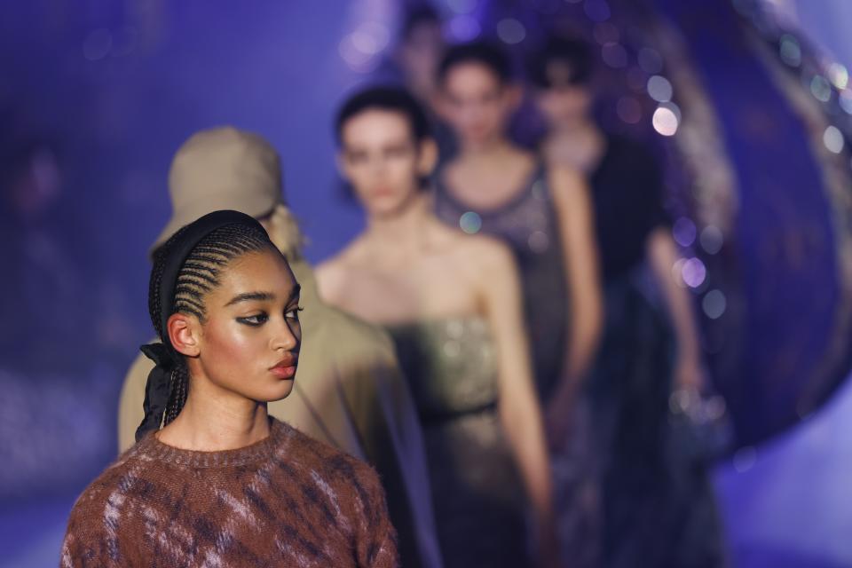 Models wear creations as part of the Christian Dior Fall/Winter 2023-2024 ready-to-wear collection presented Tuesday, Feb. 28, 2023 in Paris. (Vianney Le Caer/Invision/AP)