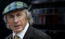 Former British Formula One World Champion Jackie Stewart talks to journalists in the paddock ahead of the British F1 Grand Prix at Silverstone, central England in this July 7, 2011 file photo. REUTERS/Leonhard Foeger/Files