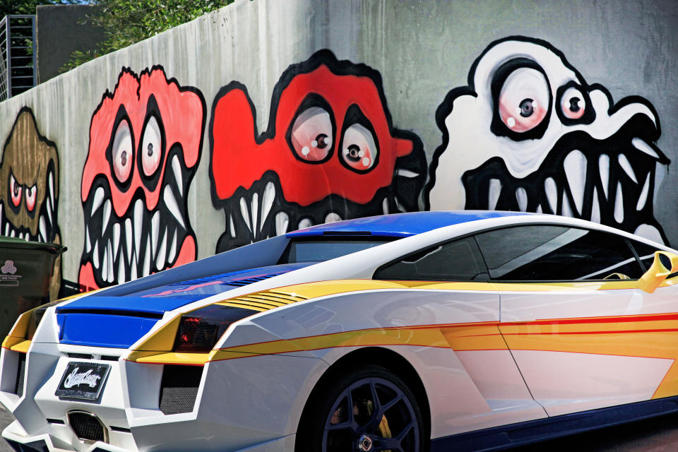 This Sunday May 12, 2013 photo shows a mural painted on the outside of musician Chris Brown's home in Los Angeles. The Grammy-winning musician's neighbors are unhappy with what some are calling frightening art he's chosen to have painted along the curb of his Hollywood Hills home. (AP Photo/Richard Vogel)