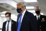 President Donald Trump wears a mask as he walks down the hallway during his visit to Walter Reed National Military Medical Center in Bethesda, Md., Saturday, July 11, 2020. (AP Photo/Patrick Semansky)