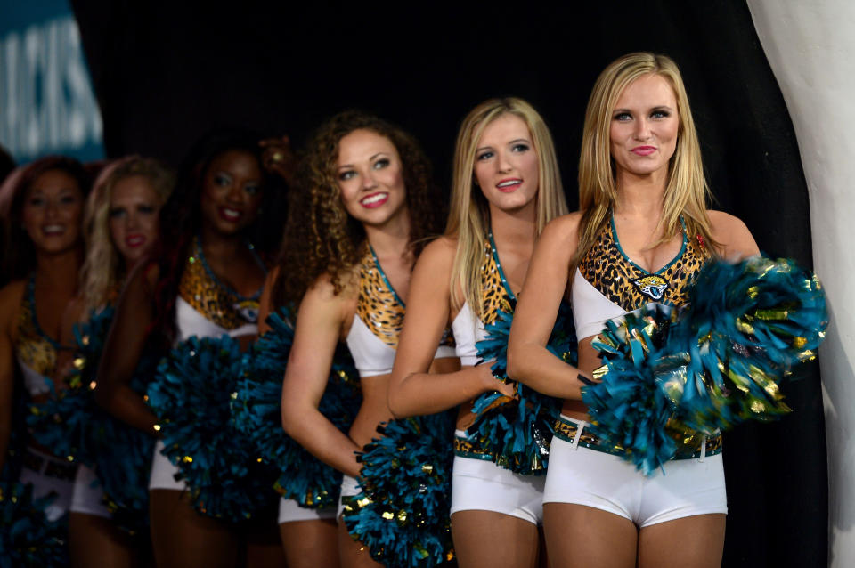 <p>Cheerleaders wait to perform ahead of the NFL International Series game between San Francisco 49ers and Jacksonville Jaguars at Wembley Stadium on October 27, 2013 in London, England. (Photo by Jamie McDonald/Getty Images) </p>