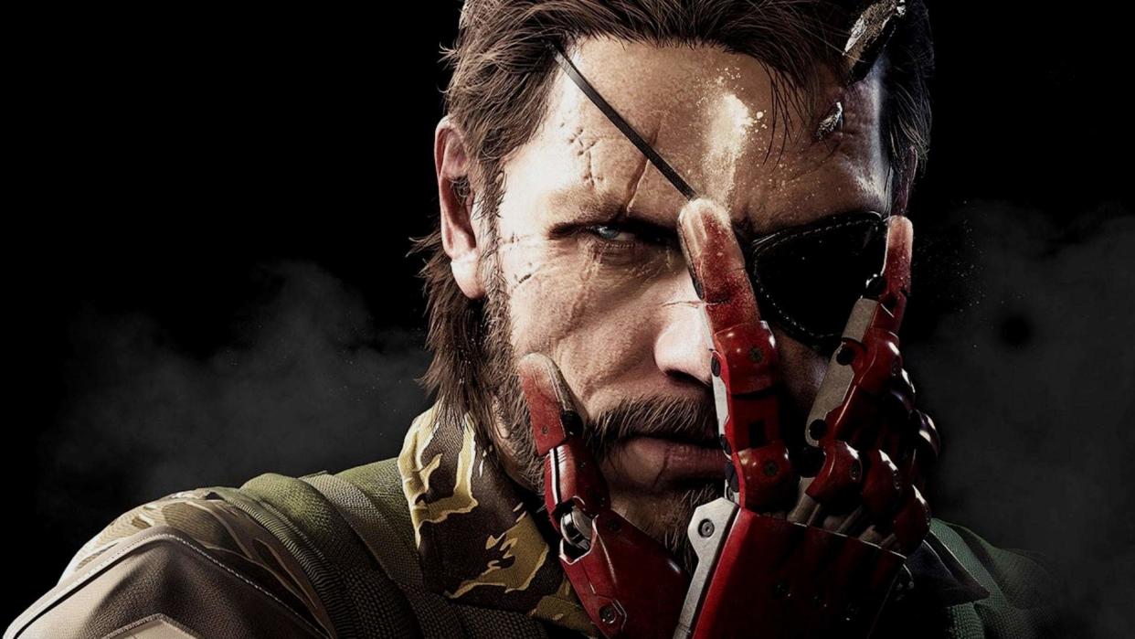  Big Boss looks at the camera while holding his hand up in front of his face. 