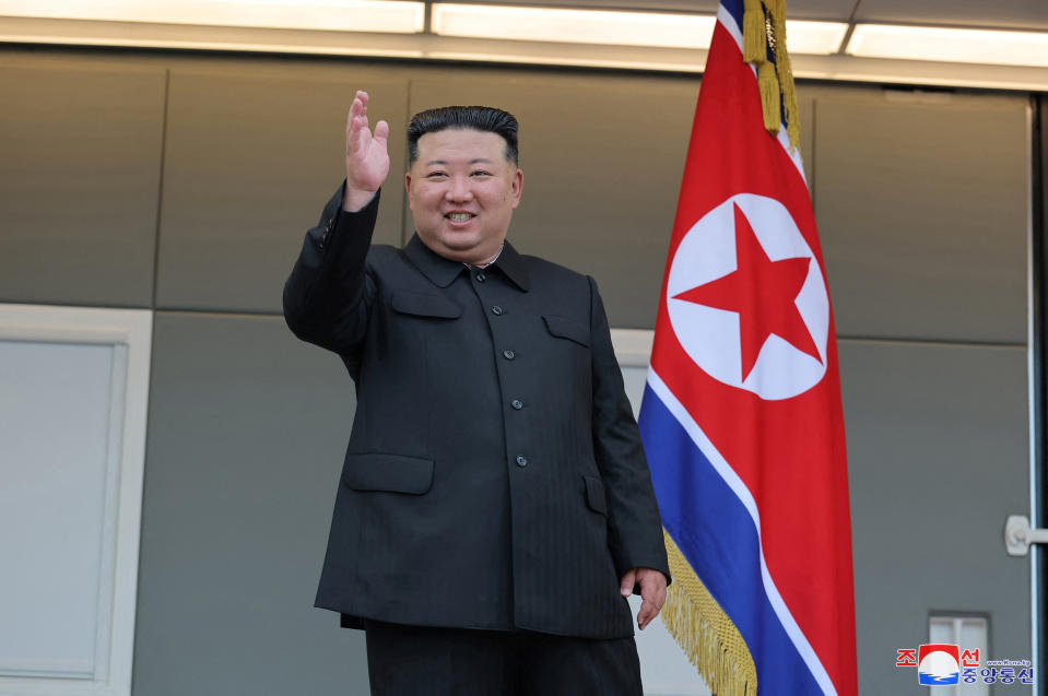 North Korean leader Kim Jong Un waves during a visit to the flood-affected area of Uiju County, North Pyongan Province, North Korea, in this photo released August 10, 2024. KCNA via REUTERS