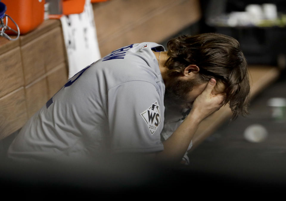 Dodgers starting pitcher Clayton Kershaw sits in the dugout after allowing a three-run homer to Houston's Yuli Gurriel in World Series Game 5. (AP)