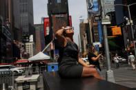 Jenney Vaverde, 42, views the solar eclipse at Times Square in Manhattan, New York, U.S., August 21, 2017. Location coordinates for this image are 40.7589° N, 73.9851° W. REUTERS/Shannon Stapleton