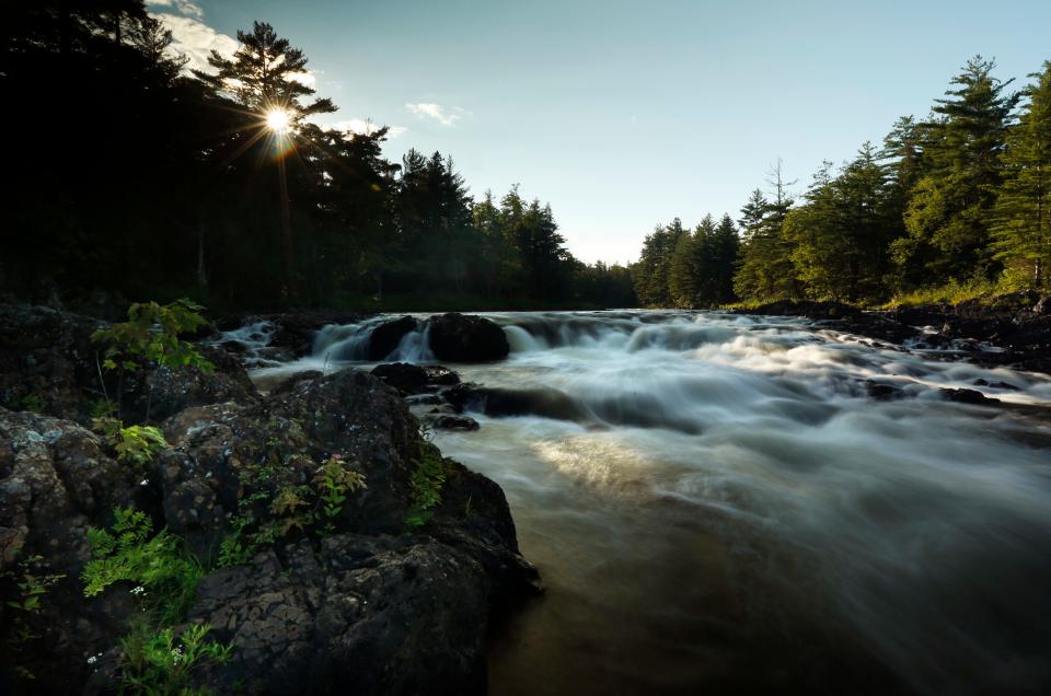 The East Branch of the Penobscot River flows over Pond Pitch in the Katahdin Woods and Waters National Monument, in northern Maine in this Aug. 9, 2017 file photo. The 87,500-acre property in Maine consists of mountains, streams and ponds next to Baxter State Park, home of Mount Katahdin, the state's tallest mountain.