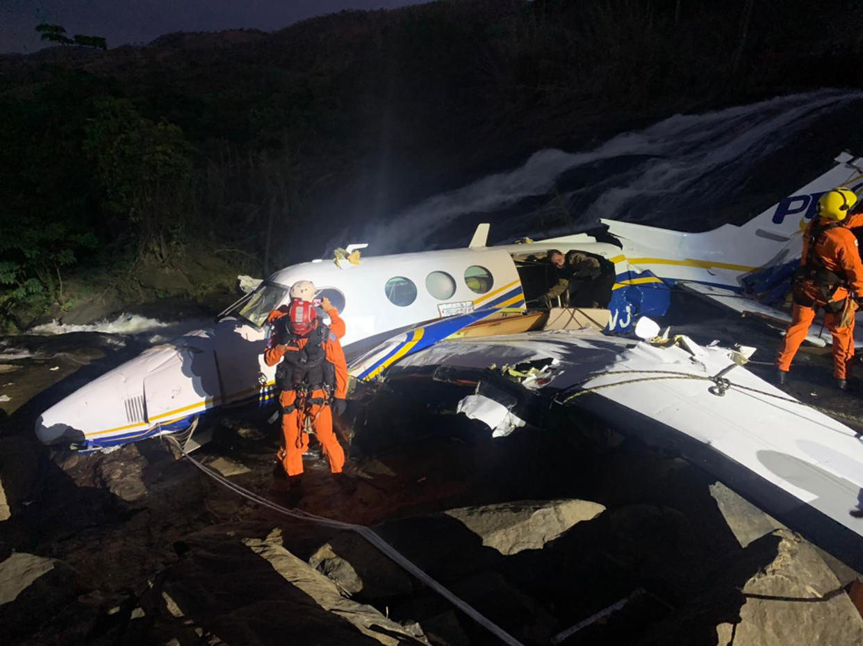 This handout photo released by Minas Gerais Military Firefighters Corps shows the airplane plane that crashed that was transporting Brazilian singer Marilia Mendonca, in the southeastern Brazilian of state Minas Gerais, Friday, Nov. 5, 2021. One of Brazil's most popular singers and a Latin Grammy winner, Mendonca died on Friday, Nov. 5, 2021, in an airplane crash on her way to a concert. Mendonça was 26 and performed country music in Brazil called sertanejo. (Minas Gerais Military Firefighters Corps via AP)