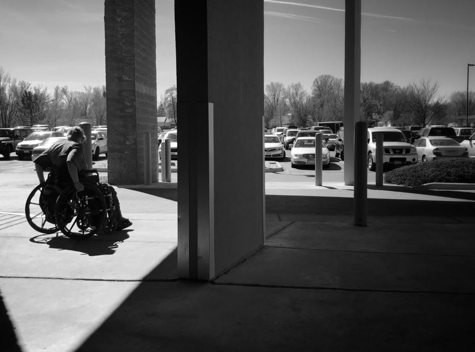 A woman waits for a ride after an appointment at Delta County Memorial Hospital. (Photo: Holly Bailey/Yahoo News)