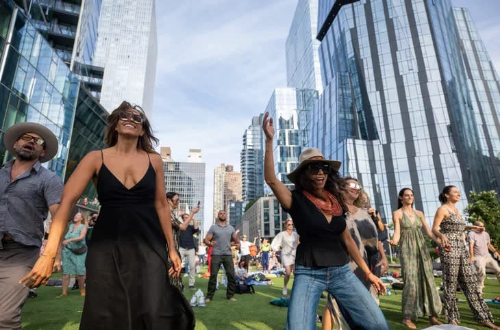 <span class="article__caption">Participants dance during an Outside-hosted gathering at Wonderfair, an immersive outdoor art experience in New York City. (Photo: Darren Miller)</span>