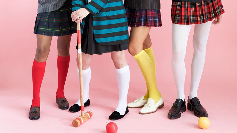 4 young women dressed as preppy characters from the 80s movie heathers for halloween