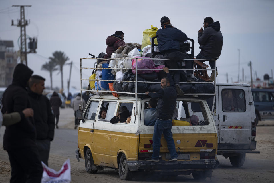 Palestinians arrive in the southern Gaza town of Rafah after fleeing an Israeli ground and air offensive in the nearby city of Khan Younis on Friday, Jan. 26, 2024. Israel has expanded its offensive in Khan Younis, saying the city is a stronghold of the Hamas militant group. (AP Photo/Fatima Shbair)