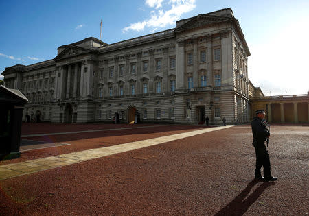 Armed police patrol the grounds of Buckingham Palace after a man was arrested at the visitor entrance of Britain's Queen Elizabeth's residence in London, Britain, September 23, 2018. REUTERS/Henry Nicholls