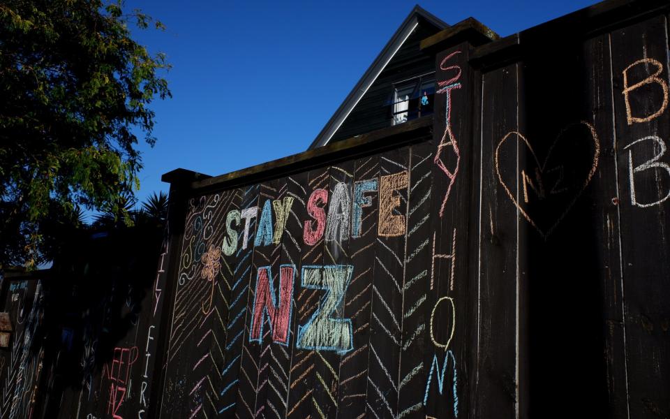 A house fence has been chalked up with messages relating to the COVID-19 lockdown on April 03, 2020 in Auckland, New Zealand - GETTY IMAGES