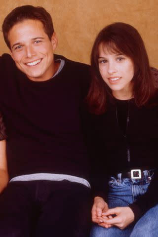 <p>Columbia Pictures/Everett</p> Scott Wolf and Lacey Chabert on 'Party of Five'