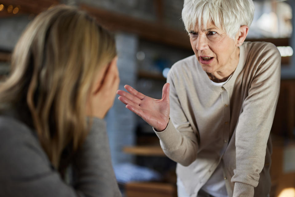 Older woman yelling at another woman