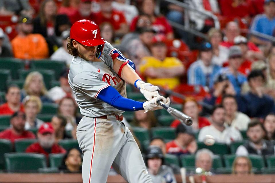 Philadelphia Phillies third baseman Alec Bohm hits an RBI-double against the St. Louis Cardinals during the 10th inning Monday, April 8, 2024, at Busch Stadium in St. Louis. The Phillies won 5-3.