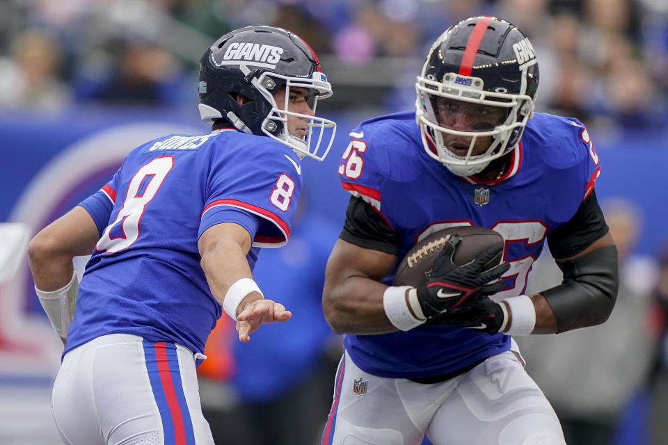 Saquon Barkley (26) is powering the New York Giants' strong start, but they'll need more from Daniel Jones and other areas of the team to sustain it. (AP Photo/John Minchillo)