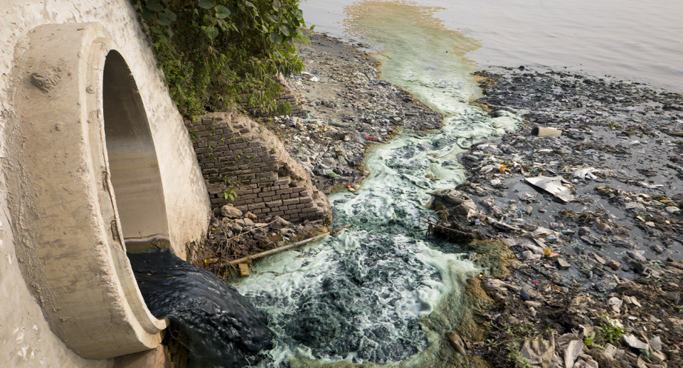 A pipe in Bangladesh leaching pollution into water.