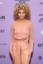 <p>Peach hair doesn't need to be vibrant — you can incorporate the shade in the most subtle ways. <strong>Michelle Hurd's</strong> curls have just the slightest whisper of peach. </p>