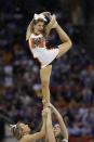 Mercer cheerleaders perform during the second half of an NCAA college basketball second-round game against Duke , Friday, March 21, 2014, in Raleigh, N.C. (AP Photo/Chuck Burton)