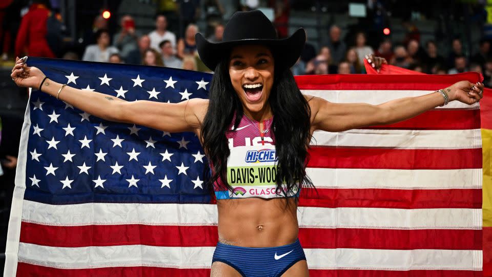 Davis-Woodhall celebrates her victory at the indoor world championships in Glasgow, Scotland. - Ben Stansall/AFP/Getty Images