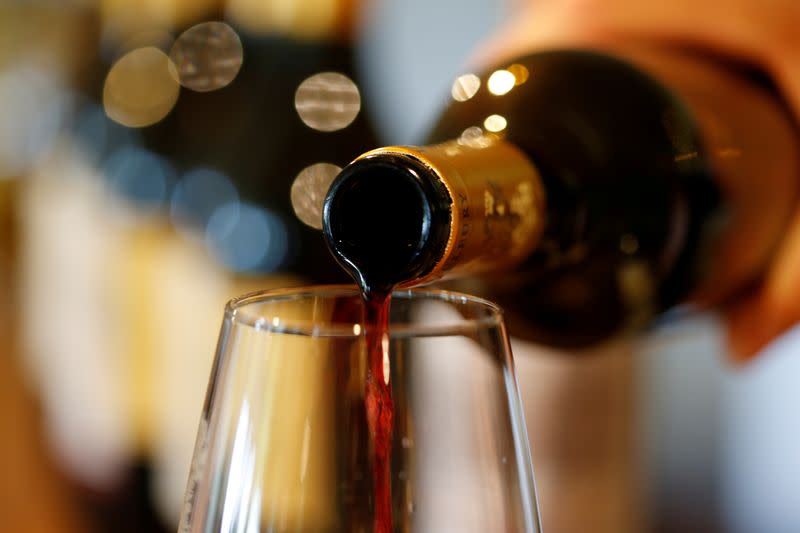 FILE PHOTO: French red wine is poured into a glass at Chateau du Pavillon in Sainte-Croix-Du-Mont,