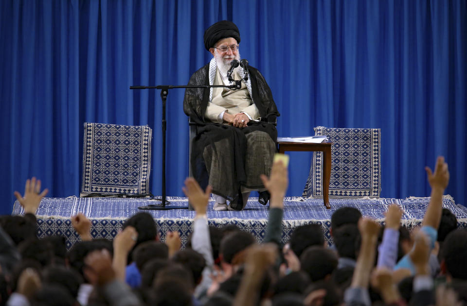 FILE - In this file photo released May 22, 2019, by an official website of the office of the Iranian supreme leader, Supreme Leader Ayatollah Ali Khamenei attends a meeting with a group of students as they chant slogans, in Tehran, Iran. On May 14, 2019, Khamenei says "no one is seeking war," but that it wouldn't be difficult for Iran to enrich uranium to weapons-grade levels. (Office of the Iranian Supreme Leader via AP, File)