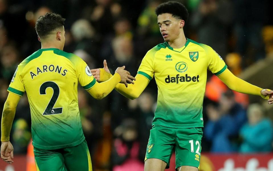 Norwich City's Jamal Lewis celebrates scoring their first goal with Max Aarons - REUTERS/Chris Radburn 