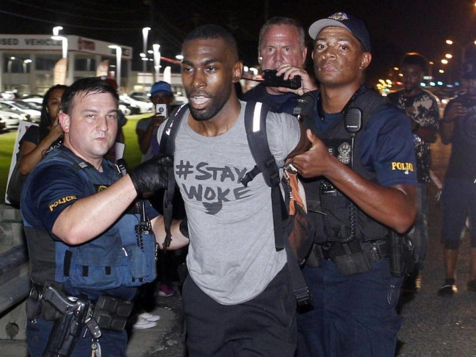 Black Lives Matter leader DeRay Mckesson, seen here in 2016, and four others are being sued by an unidentified Baton Rouge police officer for allegedly inciting and encouraging violence at demonstrations (AP)