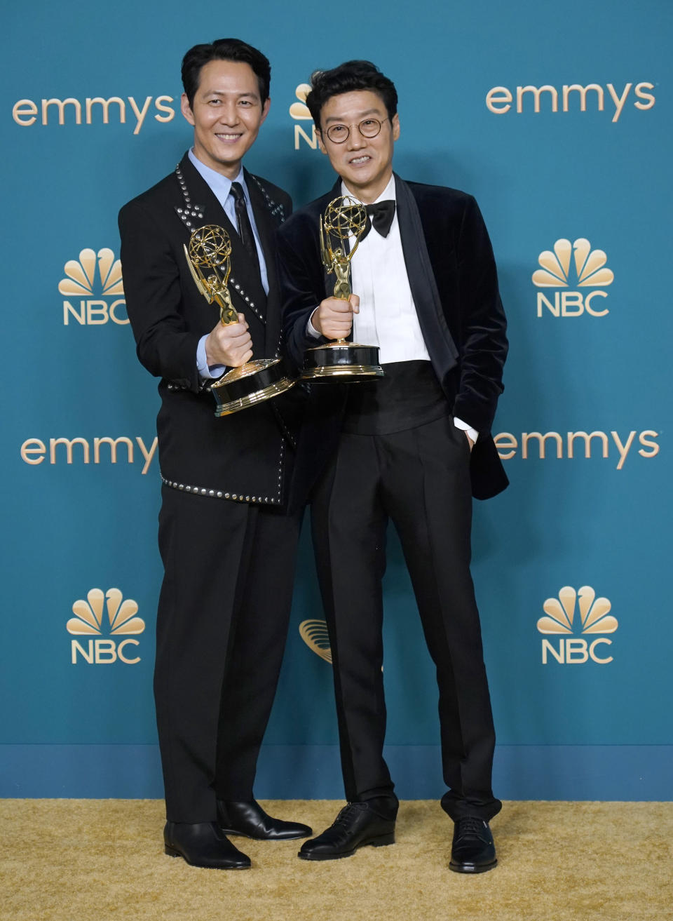 Lee Jung-jae, left, winner of the Emmy for outstanding lead actor in a drama series for "Squid Game", and Hwang Dong-hyuk, winner of the Emmy for outstanding directing for a drama series for "Squid Game", pose in the press room at the 74th Primetime Emmy Awards on Monday, Sept. 12, 2022, at the Microsoft Theater in Los Angeles. (AP Photo/Jae C. Hong)