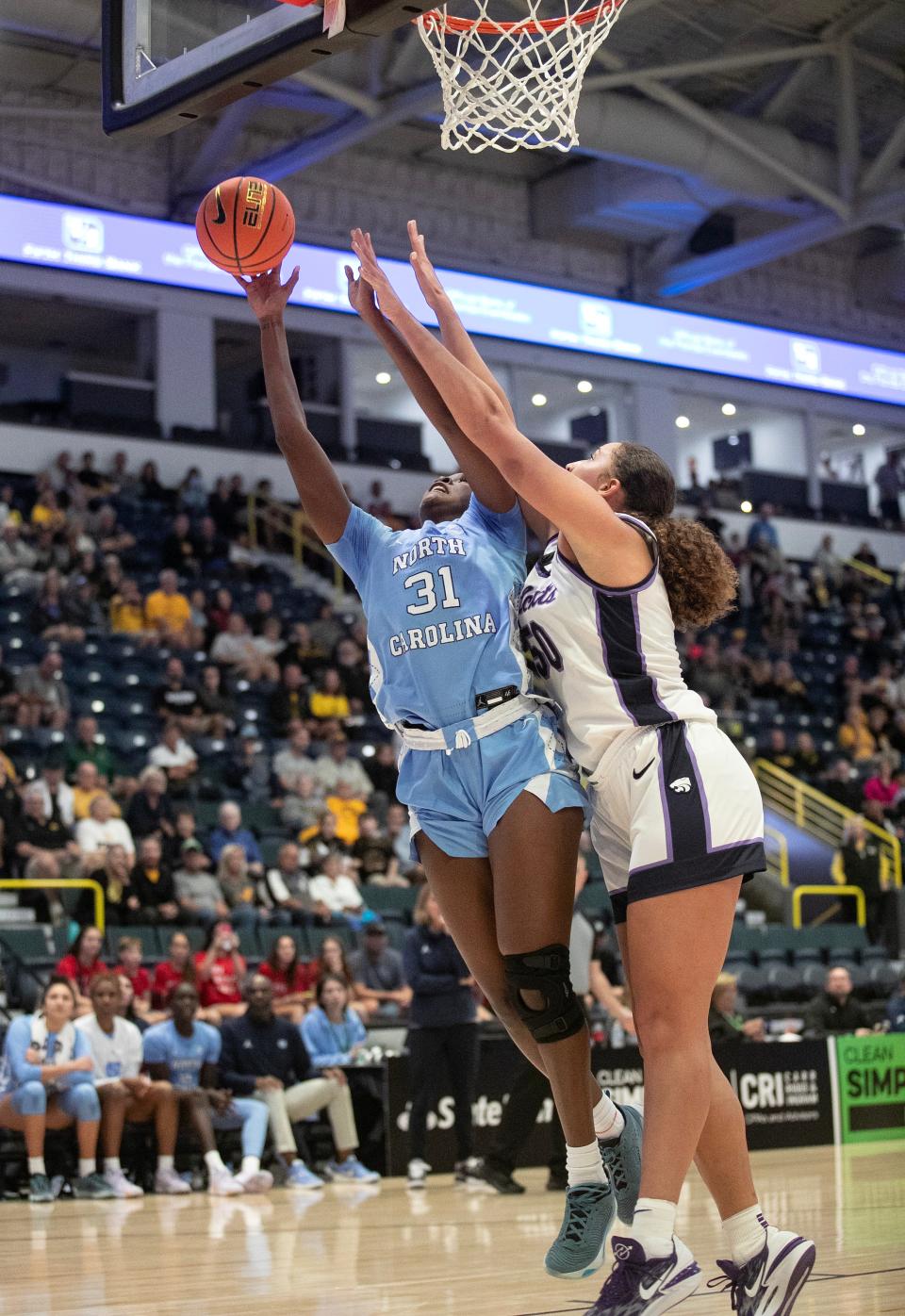 Anya Poole of UNC is guarded by Ayoka Lee of Kansas State as she takes a shot in the 2023 Women's Gulf Coast Showcase on Saturday, Nov. 25, 2023, at Hertz Arena in Estero.