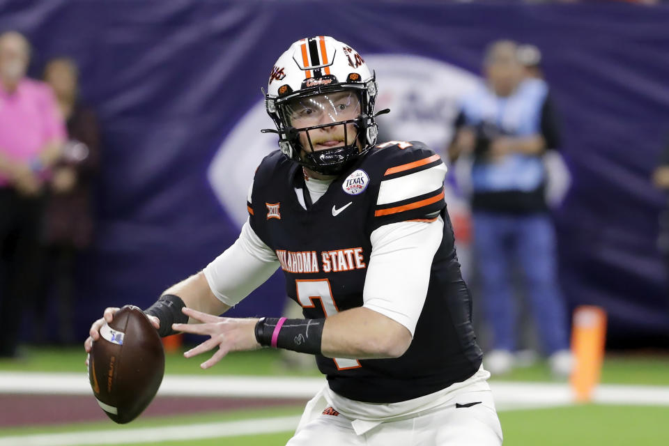Oklahoma State quarterback Alan Bowman looks to pass the ball against Texas A&M during the first half of the Texas Bowl NCAA college football game Wednesday, Dec. 27, 2023, in Houston. (AP Photo/Michael Wyke)