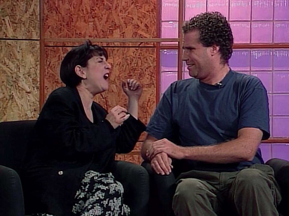 Will Ferrell arguing with a female roommate on a talk show in a scene from "Living Single"