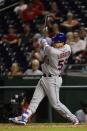 Sep 20, 2018; Washington, DC, USA; New York Mets catcher Jose Lobaton (59) hits the game winning sacrifice fly in the twelfth inning against the Washington Nationals at Nationals Park. Mandatory Credit: Tommy Gilligan-USA TODAY Sports