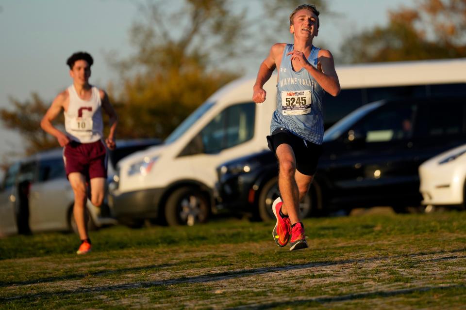 Sean Matthews (5245), of Wayne Valley, makes sure he beats Hisham Ettayebi, of Clifton, to the finish line of the  Passaic County Boys Cross Country Championship race, at Woodland Park. Matthews came in second place with a time of 16:48, one second in front of Ettayebi. Thursday, October 20, 2022