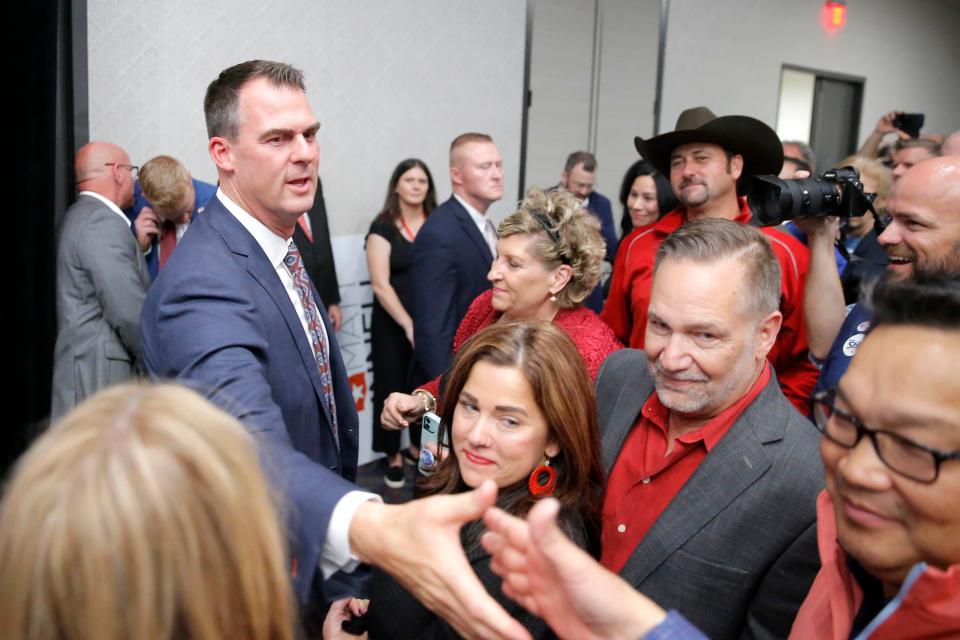 Reelected Gov. Kevin Stitt shakes hands with the crowd Tuesday, Nov. 8, 2022, during a GOP election night watch party in Oklahoma City.