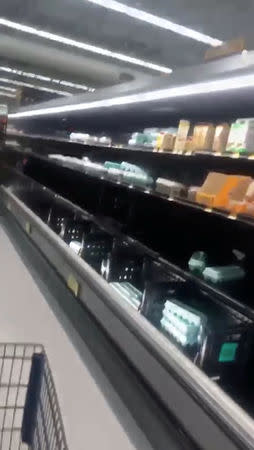 Half empty shelves are seen at a supermarket as residents prepare for Storm Florence's descent in Columbia, South Carolina, U.S., September 10, 2018, in this still image taken from a video obtained from social media. @missgil/via REUTERS