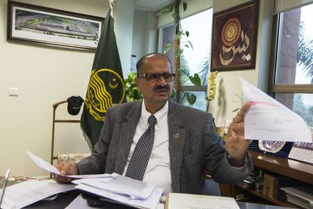 Mohammad Ashraf Tahir, Director General of Punjab Forensic Science Agency, talks to Reuters journalists at his office in Lahore January 13, 2015. REUTERS/Zohra Bensemra