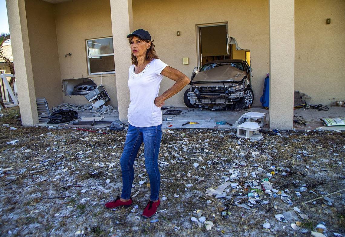 Fort Myers resident JoAnn Knobloch stands in the yard of her badly damaged Estero Boulevard house, Oct. 26, 2022. Knobloch’s husband drowned in Hurricane Ian’s storm surge a month earlier.