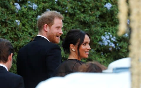 The Sussexes appeared in good spirits as they arrived at the wedding - Credit: Reuters