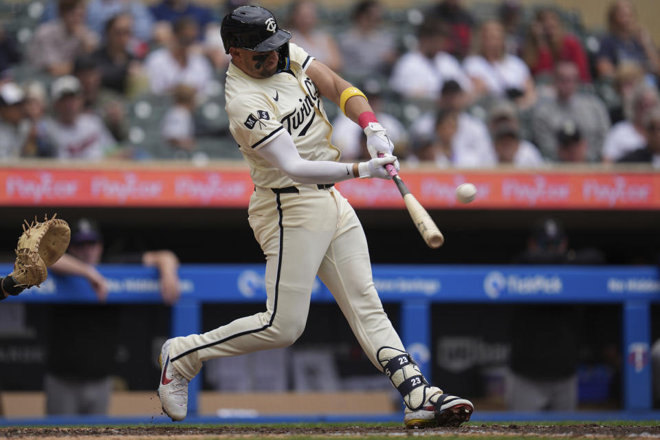 Minnesota Twins' Royce Lewis hits a two-run home run during the sixth inning of a baseball game against the Colorado Rockies, Wednesday, June 12, 2024, in Minneapolis. (AP Photo/Abbie Parr)