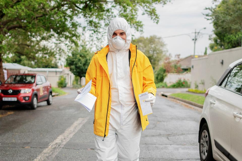 A Scientology volunteer walks in Parkhurst, Johannesburg, as he distributes both healthcare prevention against COVID-19 coronavirus and Scientology brochures, on April 2, 2020, during the sixth day of the 21-day national lockdown announced by South African President Cyril Ramaphosa to avoid the spread of the COVID-19 coronavirus outbreak. (Photo by Luca Sola / AFP) (Photo by LUCA SOLA/AFP via Getty Images)