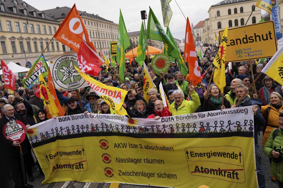 People attend a rally marking the nuclear shutdown in Germany in Munich, Germany, Saturday, April 15, 2023. Germany is shutting down the last three nuclear power plants today as a part of an energy transition agreed by successive governments. (AP Photo/Matthias Schrader)