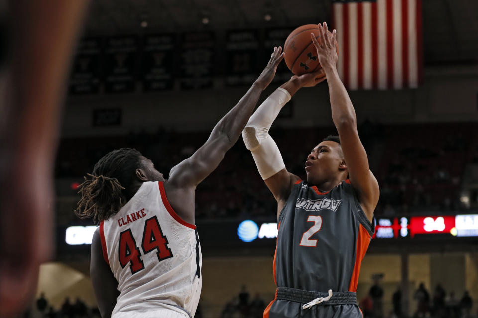 Texas-Rio Grande Valley's Quinton Johnson II (2) shoots the ball over Texas Tech's Chris Clarke (44) during the second half of an NCAA college basketball game Saturday, Dec. 21, 2019, in Lubbock, Texas. (AP Photo/Brad Tollefson)