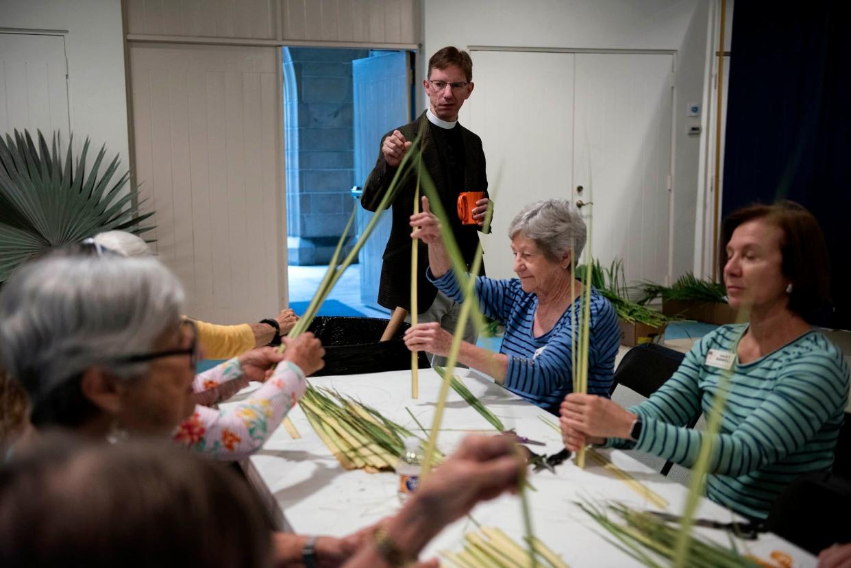 The Rev. Tim Schenck visits volunteers and flower guild members to thank them.
