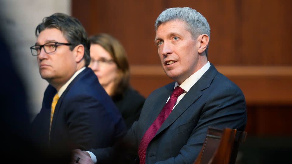 Attorneys Eric Olson, right, and Sean Grimsley listen as Jason Murray argues before the Colorado Supreme Court on Wednesday, Dec. 6, 2023, in Denver. - David Zalubowski/AP