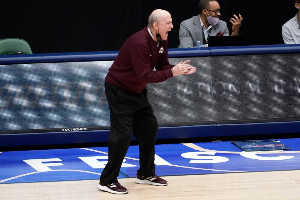 Mississippi State head coach Ben Howland applauds his team in the first half of an NCAA college basketball championship game against Memphis in the NIT, Sunday, March 28, 2021, in Frisco, Texas. (AP Photo/Tony Gutierrez)