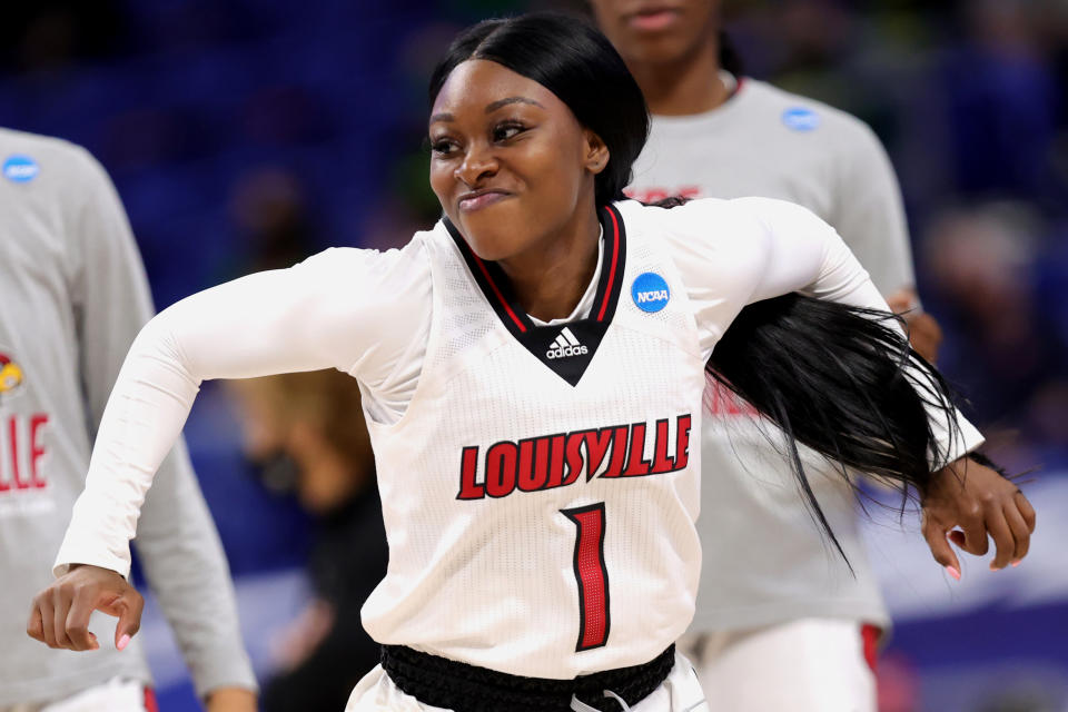 SAN ANTONIO, TEXAS - MARCH 28: Dana Evans #1 of the Louisville Cardinals enters the game against the Oregon Ducks in the Sweet Sixteen round of the NCAA Women's Basketball Tournament at the Alamodome on March 28, 2021 in San Antonio, Texas. (Photo by Carmen Mandato/Getty Images)