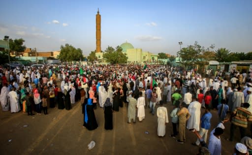 Sudanese celebrate in Khartoum after protest leaders struck a power-sharing deal with the ruling generals